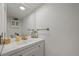 Clean bathroom featuring white vanity with gold fixtures and large mirror at 530 Tam O Shanter, Las Vegas, NV 89109
