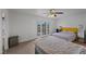 Light-filled bedroom with two beds and double doors to a balcony at 530 Tam O Shanter, Las Vegas, NV 89109