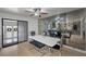 Dining room featuring a modern table, mirrored wall, light ceiling fan and outside view at 530 Tam O Shanter, Las Vegas, NV 89109