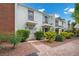 Charming townhome with two balconies, beautiful landscaping, and brick pathway at 530 Tam O Shanter, Las Vegas, NV 89109