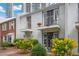 Charming townhome with two balconies, beautiful landscaping, and brick pathway at 530 Tam O Shanter, Las Vegas, NV 89109
