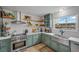 Charming kitchen featuring stainless steel appliances, a farmhouse sink, and shaker style cabinets at 530 Tam O Shanter, Las Vegas, NV 89109