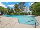 Inviting community pool with clear blue water and lounge chairs at 530 Tam O Shanter, Las Vegas, NV 89109