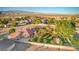 Residential single-story home with mature landscaping and a terra cotta colored tile roof at 5701 Mary Lou St, Pahrump, NV 89061