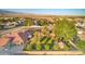 Residential single-story home with mature landscaping, well maintained lawn, desert landscape at 5701 Mary Lou St, Pahrump, NV 89061