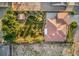 Beautifully landscaped backyard featuring a lush lawn, decorative stone pathway, and a storage shed at 5701 Mary Lou St, Pahrump, NV 89061