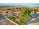 Residential single-story home with mature landscaping, well maintained lawn and fully enclosed yard at 5701 Mary Lou St, Pahrump, NV 89061