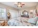 Well-lit bedroom with a ceiling fan, wood floors, and closet space at 5701 Mary Lou St, Pahrump, NV 89061