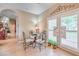Cozy dining area near the kitchen, featuring tiled floors and access to the patio at 5701 Mary Lou St, Pahrump, NV 89061