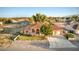 Charming single-story home with a well-maintained lawn, desert landscaping, with a three car garage at 5701 Mary Lou St, Pahrump, NV 89061