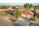 Charming single-story home with a terra cotta colored roof, mature landscaping and three car garage at 5701 Mary Lou St, Pahrump, NV 89061