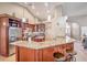 Stylish kitchen with granite countertops, stainless steel appliances, and a breakfast bar at 5701 Mary Lou St, Pahrump, NV 89061