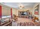 Inviting living area with ample seating and natural light from large windows at 5701 Mary Lou St, Pahrump, NV 89061