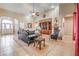 An open concept living room, arched entryway, and neutral colored walls and flooring at 5701 Mary Lou St, Pahrump, NV 89061