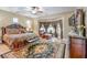 Beautiful primary bedroom features a large bed, sitting area, and decorative rug at 5701 Mary Lou St, Pahrump, NV 89061