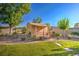 Charming backyard shed with a cozy porch, surrounded by trees and lush landscaping at 5701 Mary Lou St, Pahrump, NV 89061