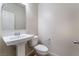 Bathroom featuring pedestal sink, standard toilet, and neutral paint at 6412 Dimatteo St, Las Vegas, NV 89148