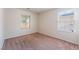 Neutral bedroom with plush carpeting and two windows offering plenty of natural light at 6412 Dimatteo St, Las Vegas, NV 89148