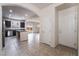 Inviting entryway featuring tile flooring, a coat closet, and an archway leading into the kitchen at 6412 Dimatteo St, Las Vegas, NV 89148