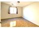 Bedroom featuring neutral walls and flooring and a window at 6968 Hopkins Dr, Las Vegas, NV 89156