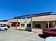 Two-story apartment complex featuring balconies and a parking lot with a view of the surrounding buildings at 6968 Hopkins Dr, Las Vegas, NV 89156