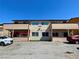 A two-story apartment complex with a parking area in front and an awning on the ground level deck at 6968 Hopkins Dr, Las Vegas, NV 89156