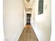 Long hallway with neutral walls and flooring at 6968 Hopkins Dr, Las Vegas, NV 89156
