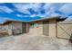 Spacious backyard featuring a concrete patio and access doors to the property at 701 Harvard St, Las Vegas, NV 89107