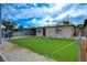 Charming home showcasing a well-kept front yard and convenient carport at 701 Harvard St, Las Vegas, NV 89107