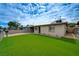 Charming home showcasing a well-kept front yard and convenient carport at 701 Harvard St, Las Vegas, NV 89107