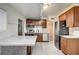 Eat in kitchen with stainless appliances, island, and white countertops at 701 Harvard St, Las Vegas, NV 89107
