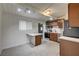 Eat in kitchen featuring bright lighting, stainless appliances, and wood cabinets at 701 Harvard St, Las Vegas, NV 89107