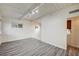 Bright living room with wood-look floors and white painted wood beam ceiling at 701 Harvard St, Las Vegas, NV 89107