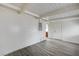 Living room featuring laminate floors, neutral paint, and doors at 701 Harvard St, Las Vegas, NV 89107