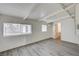 Living room featuring natural light, laminate flooring, and a window at 701 Harvard St, Las Vegas, NV 89107