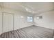 Bright living room featuring wood-look floors, a front door, and a closet at 701 Harvard St, Las Vegas, NV 89107