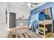 Fun bedroom featuring a play tent, blue accent wall, ceiling fan and neutral decor at 7122 Red Gulch St, North Las Vegas, NV 89084