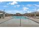 Large rectangular community pool with lounge seating and neighborhood views at 7122 Red Gulch St, North Las Vegas, NV 89084
