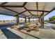 A covered picnic area provides a shady spot to enjoy outdoor meals and gatherings at 7122 Red Gulch St, North Las Vegas, NV 89084