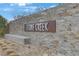 Stone Creek community sign featuring stacked stone wall and metal lettering at 7122 Red Gulch St, North Las Vegas, NV 89084