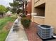 Exterior view of multi-Gathering dwelling with sidewalk, grass, and common area at 8101 W Flamingo Rd # 1102, Las Vegas, NV 89147