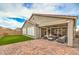 Charming backyard featuring artificial turf and a brick-paver patio perfect for relaxing at 8257 Skye Peak St, Las Vegas, NV 89166