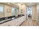 Bathroom featuring dual sinks, vanity with dark countertop, and walk-in shower at 8257 Skye Peak St, Las Vegas, NV 89166