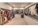 Spacious walk-in closet with ample storage and carpet floors at 8257 Skye Peak St, Las Vegas, NV 89166