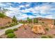 Community park featuring a walkway, shrubs, and a rock climbing play structure at 8257 Skye Peak St, Las Vegas, NV 89166