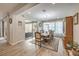 Charming dining room boasts a modern chandelier and a view of the backyard patio at 8257 Skye Peak St, Las Vegas, NV 89166