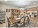 Elegant dining room features an ornate hutch, a ceiling light fixture, and adjacent kitchen access at 8257 Skye Peak St, Las Vegas, NV 89166