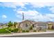 Charming single-story home with a well-manicured lawn and an inviting, gated courtyard entry at 8257 Skye Peak St, Las Vegas, NV 89166