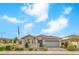 Beautiful single-story home featuring stone accents, a tile roof, a two-car garage, and low-maintenance landscaping at 8257 Skye Peak St, Las Vegas, NV 89166