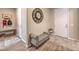 Inviting foyer featuring a bench, coat rack, and a decorative clock, enhancing the home's appeal at 8257 Skye Peak St, Las Vegas, NV 89166